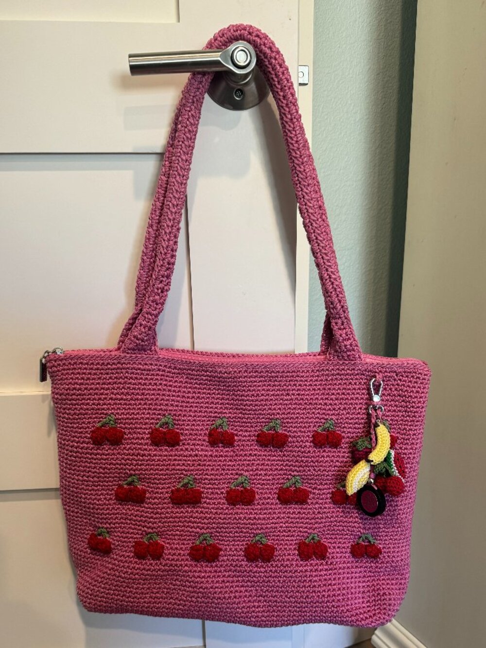 The Sak “Crafted Classics” caryall tote in pink with hand‑crocheted c